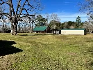 2-story, 3/2 brick home with large front and back porch sits on 17.5(+/-) acres. MLS#: 56305114